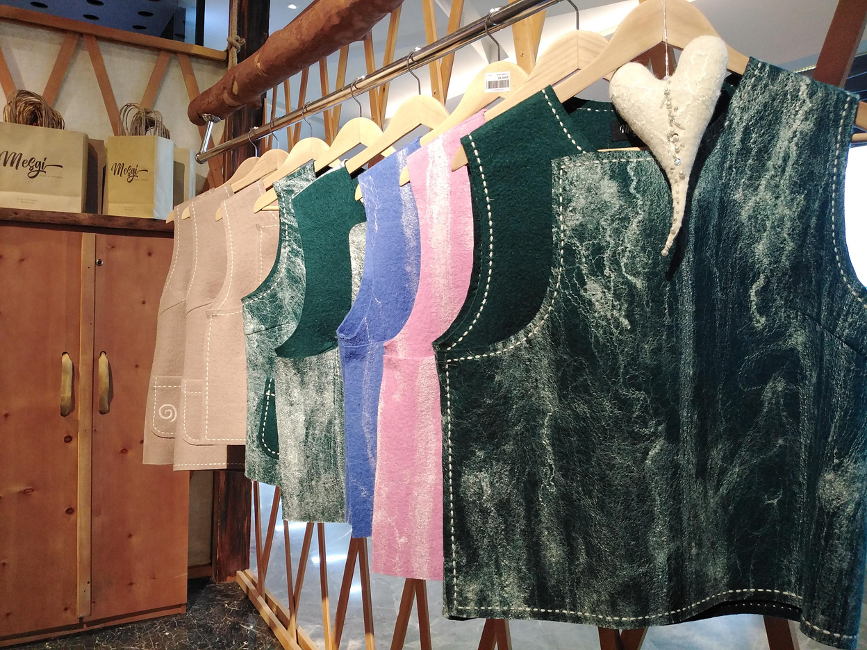 A selection of Mesgi wool garments displayed on a clothing rail